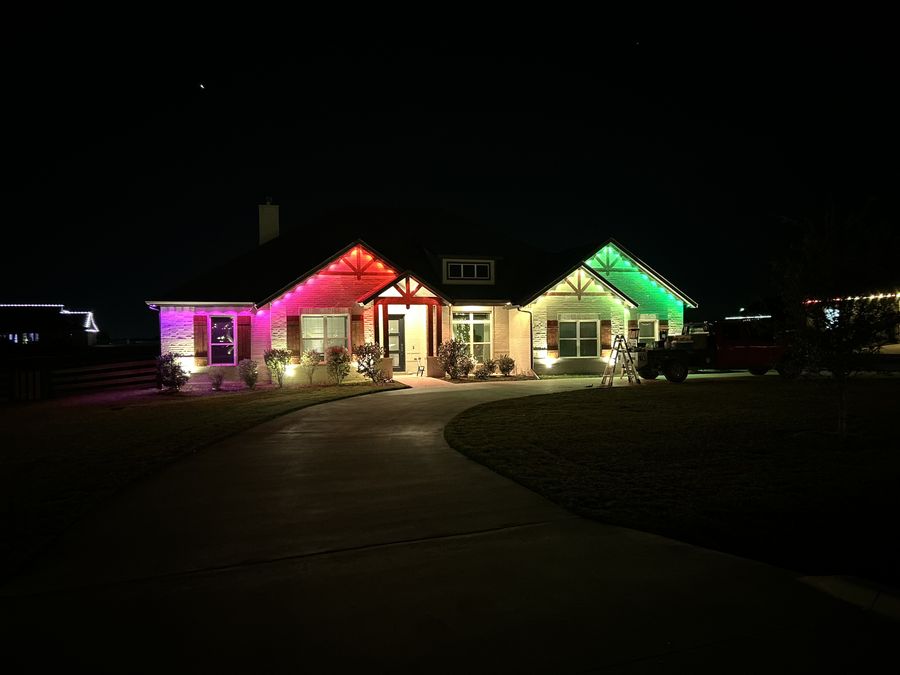 Red and green lighting install in progress with work truck